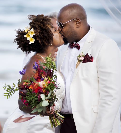 Newly married couple kissing